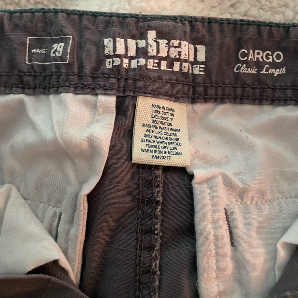 Men’s size 29 waist Urban Pipeline cargo shorts in charcoal gray.
